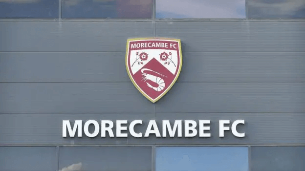 National League Halts Morecambe Amid Turmoil